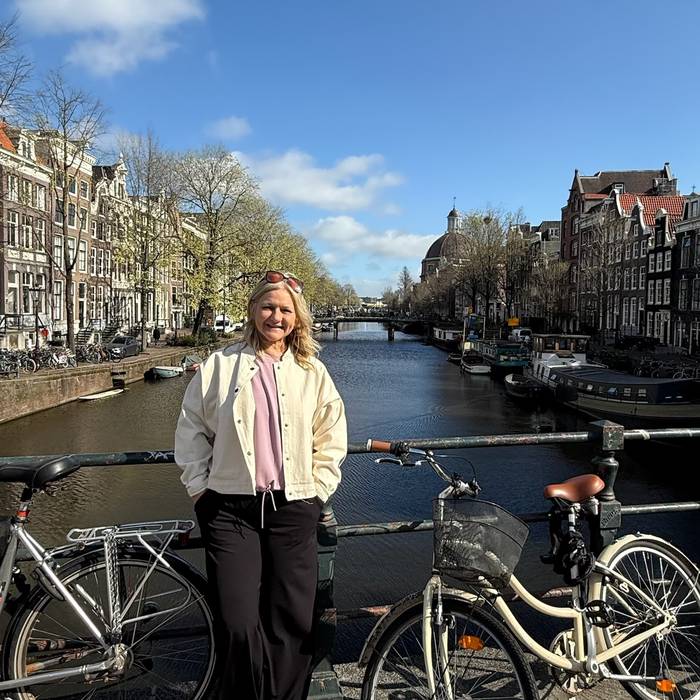 Scenic canal lined with historic buildings in Amsterdam, Netherlands