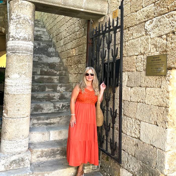 Traveler among ancient ruins and olive groves in Athens, Greece